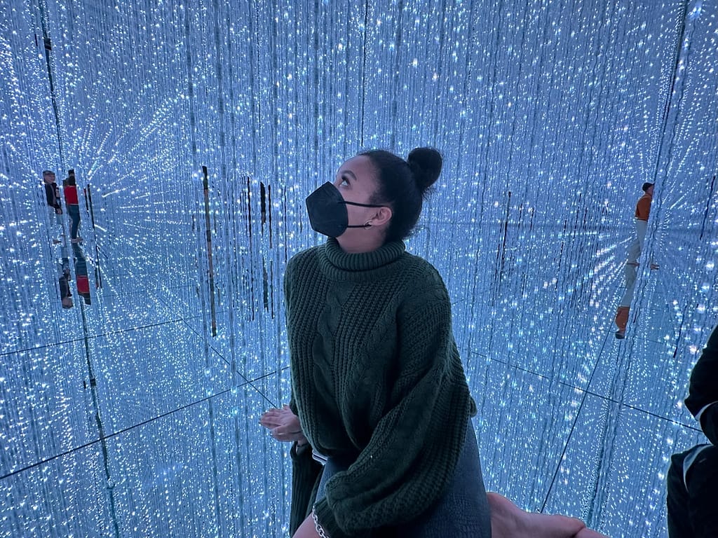 Girl staring at lights at Tokyo teamLabs