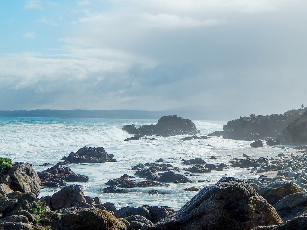 Picture of the restless sea with waves crashing into rocks in Monterey California