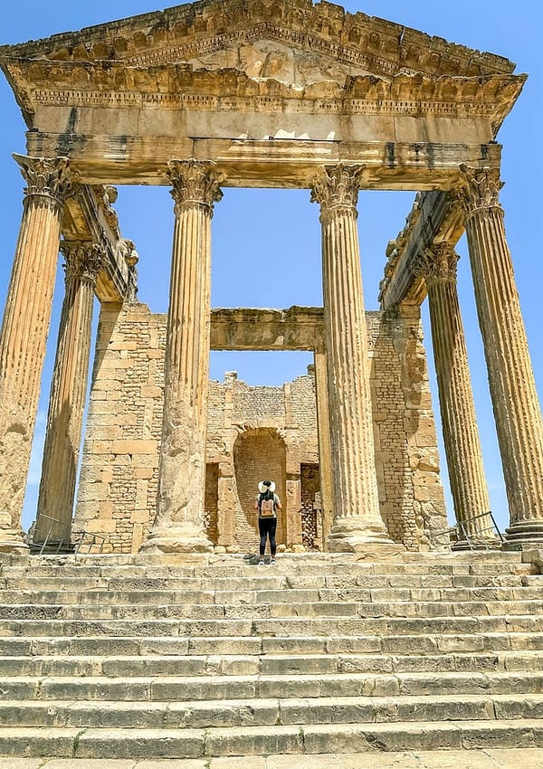 Girl standing in front of a Dougga temple