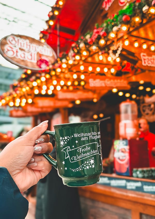 Picture of girl holding up gluhwein mug