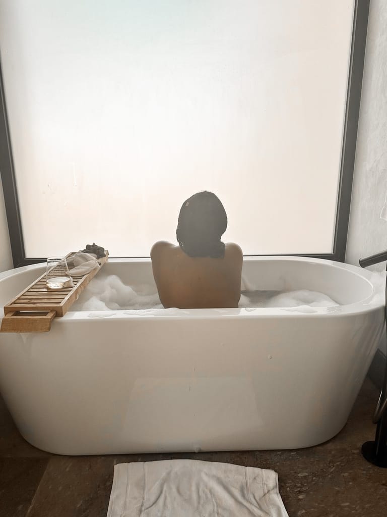Girl taking a bath in the one-bedroom pool villa