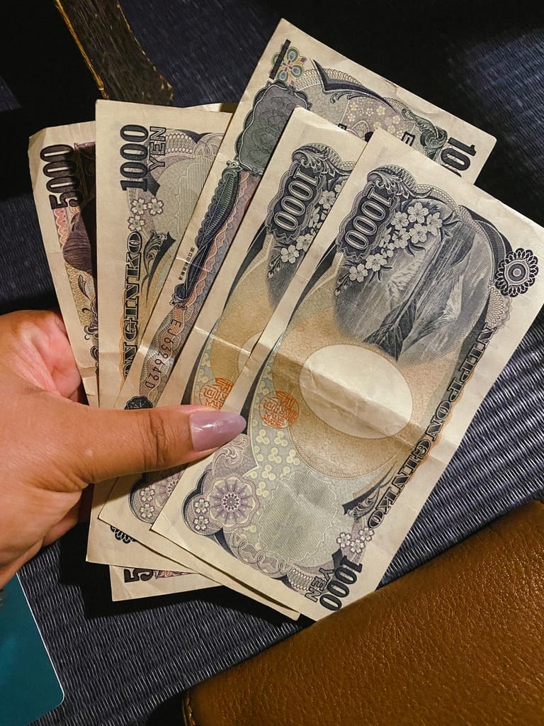 Picture of a girl holding yen
