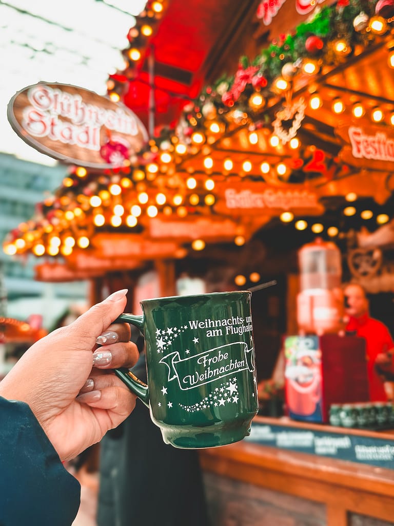 Picture of girl holding up gluhwein mug