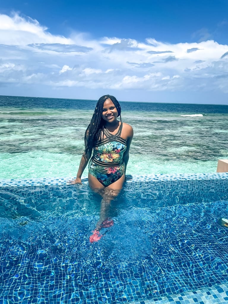 Girl in Deluxe Water Villa plunge pool at Lily Beach Resort and Spa, Maldives