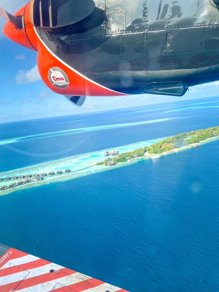 Seaplane flying over Maldives atols