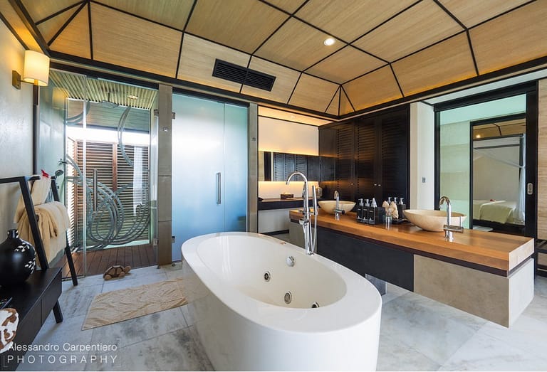 View of the Deluxe Water Villa suite bathroom with standalone tub