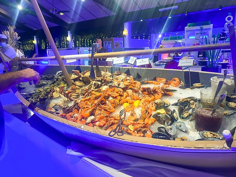 "Boat" filled with seafood on display in a buffet