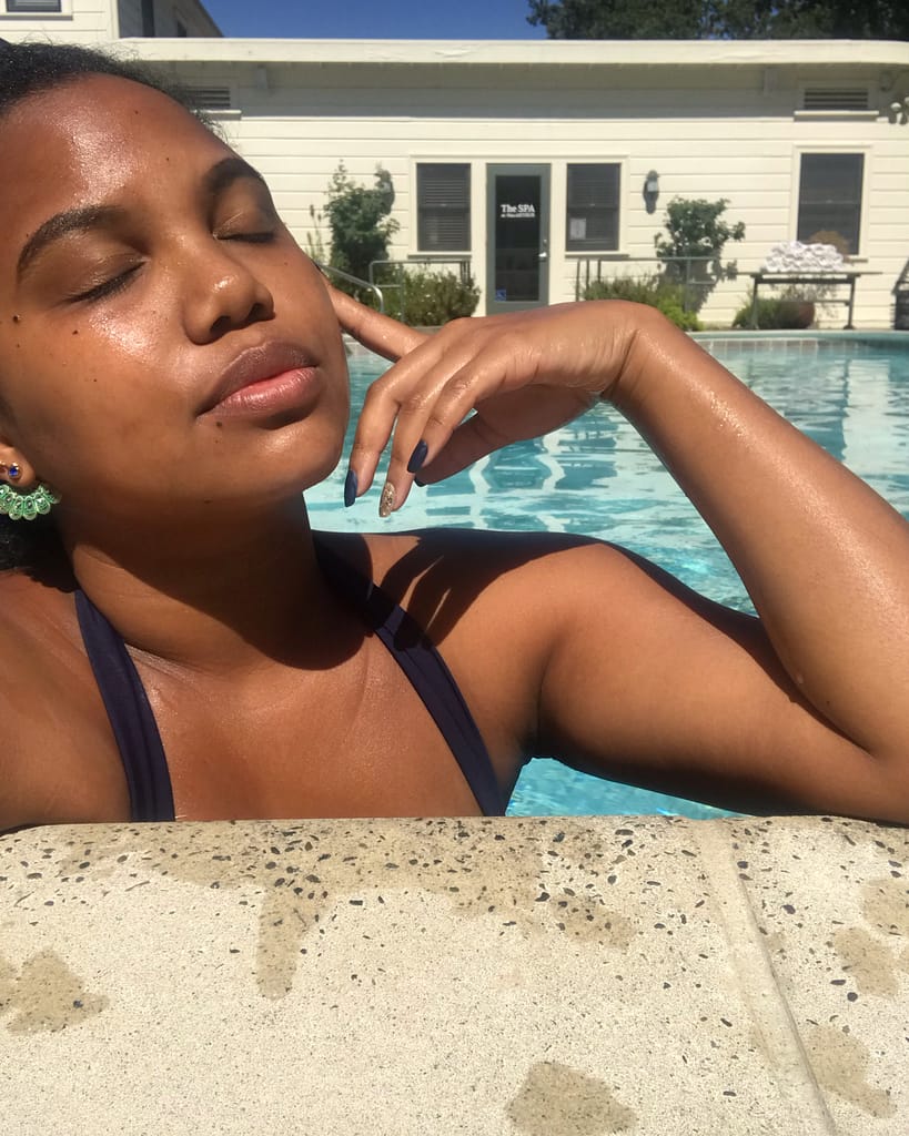 Girl sitting in the pool